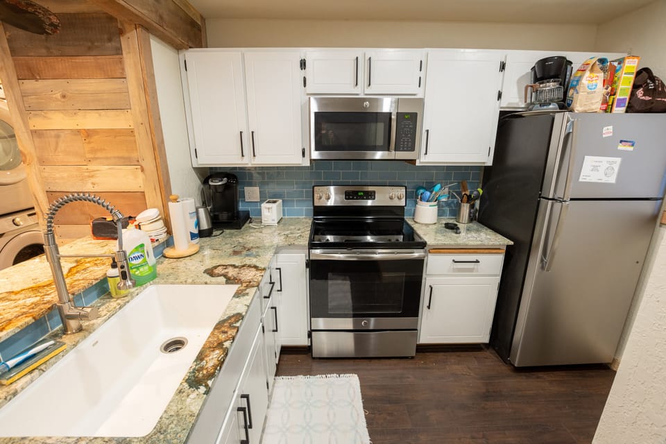 Fully stocked kitchen with pots/pans/utensils.  