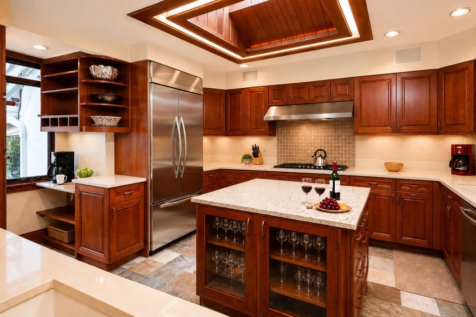 Your gourmet kitchen awaits with rich cherry cabinetry, granite counters, and stainless appliances. The center island invites you to gather for wine and conversation under elegant recessed lighting.