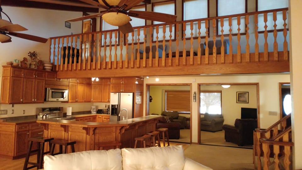 Kitchen open area, with upper mezzanine sitting/reading area