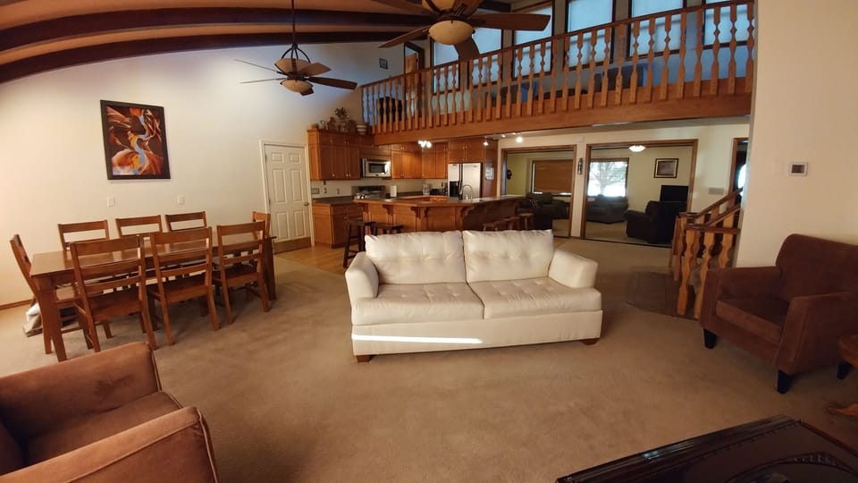 Great room sitting area, dining, kitchen, with living room connection