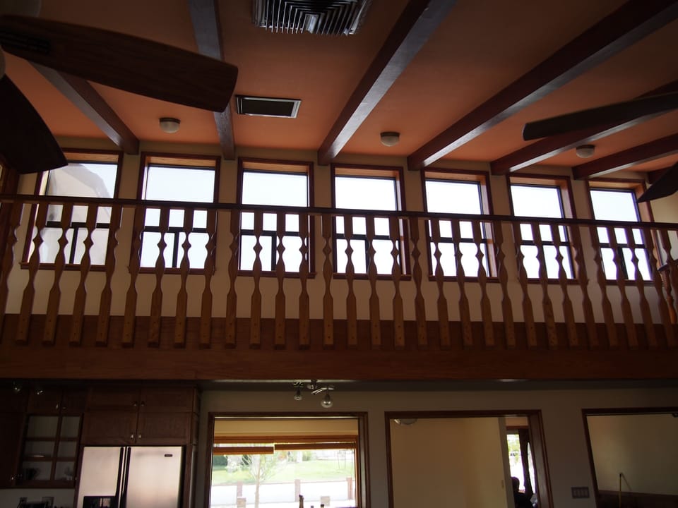 Vaulted ceiling with mezzanine overlooking the great room and kitchen