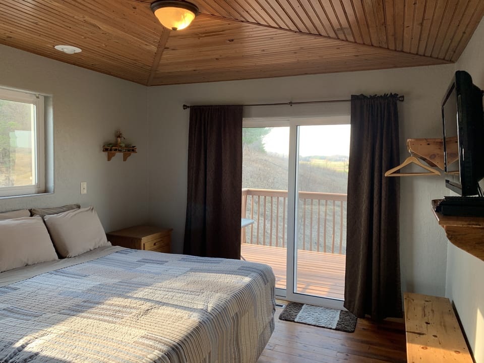 King room looks onto a large balcony. Enjoy a tasty beverage and enjoy the view.