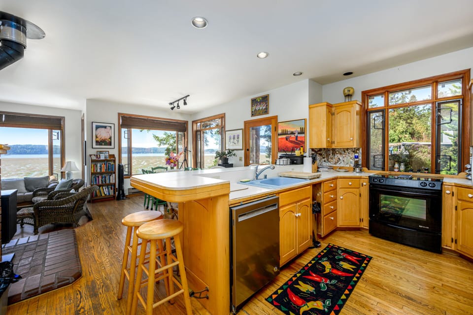 Main floor. View to the bay from kitchen, dining area, bar, & living room. 