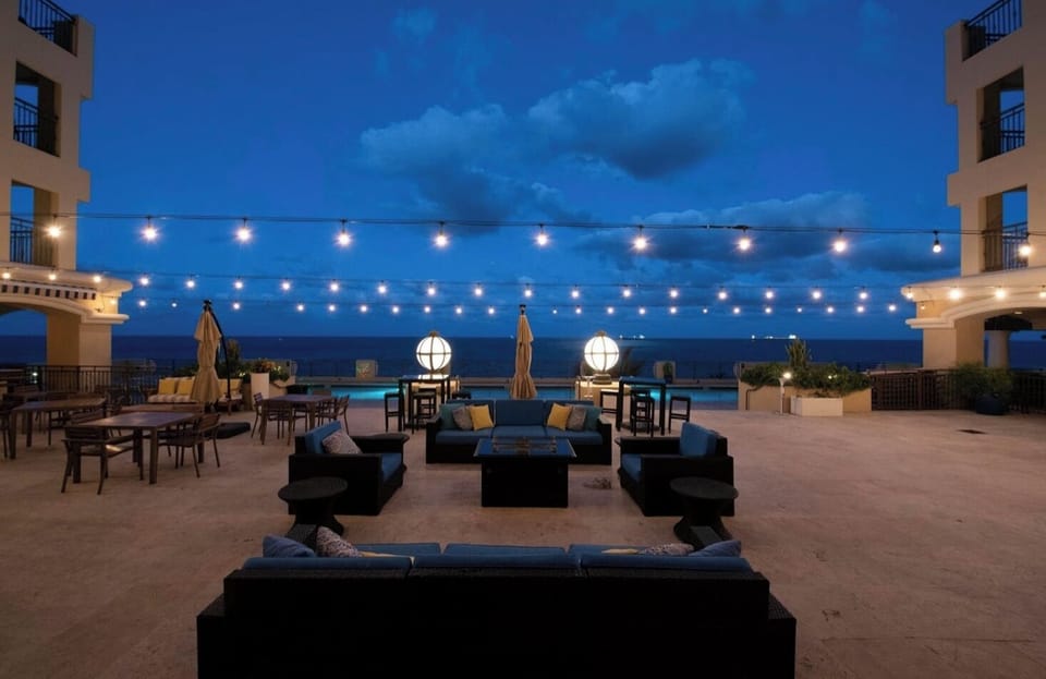 Watch the waves from the pool deck in the evening