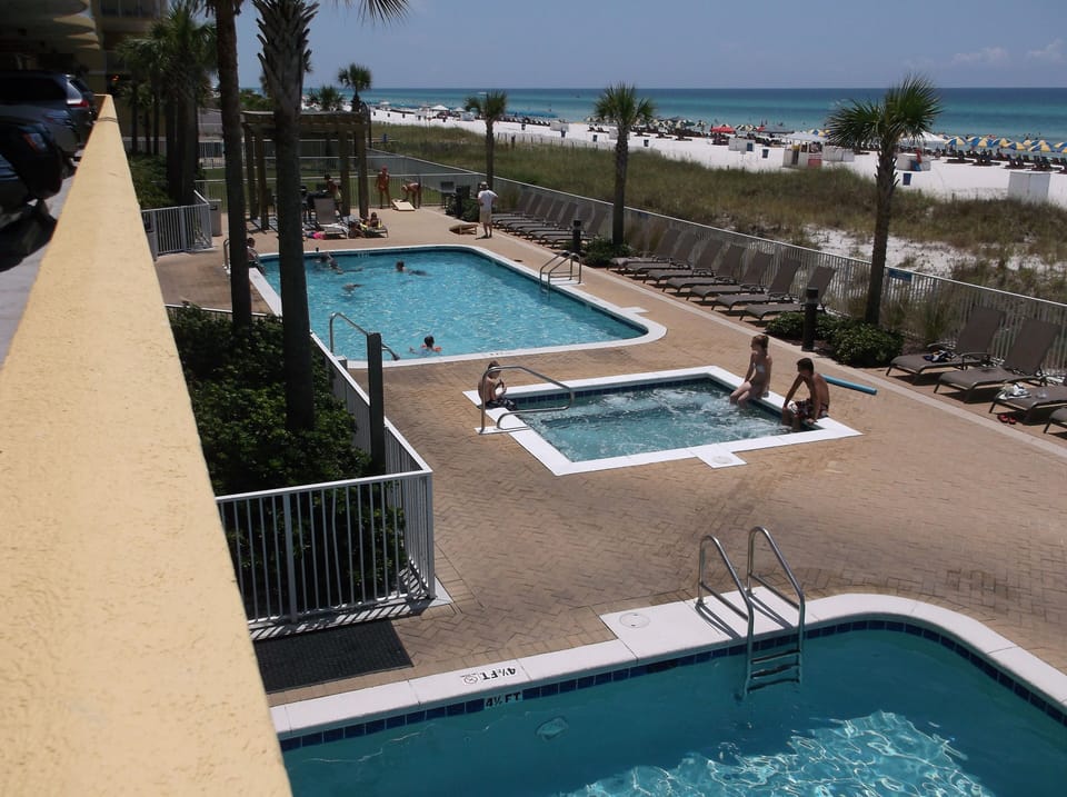 View of Indoor/Outdoor Pool, Hot Tub, Outdoor Pool and Grilling Area