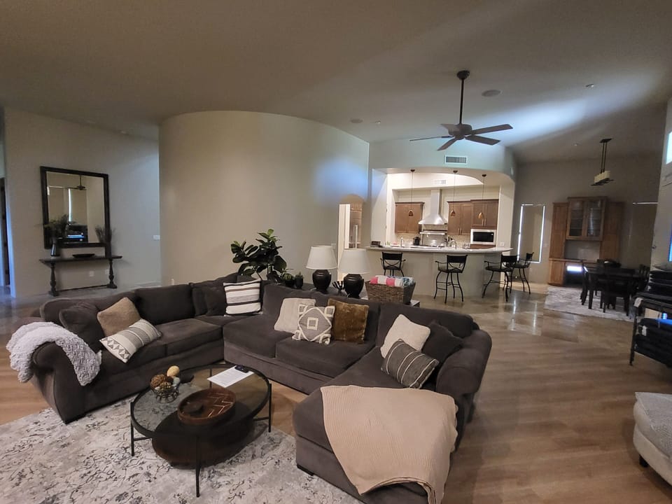 Open concept living room with kitchen and dining area 
