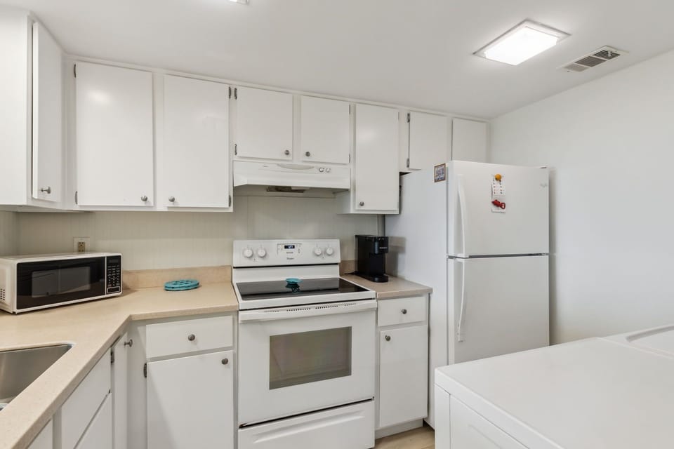 Fully equipped kitchen with Keurig coffee maker for your caffeine needs.