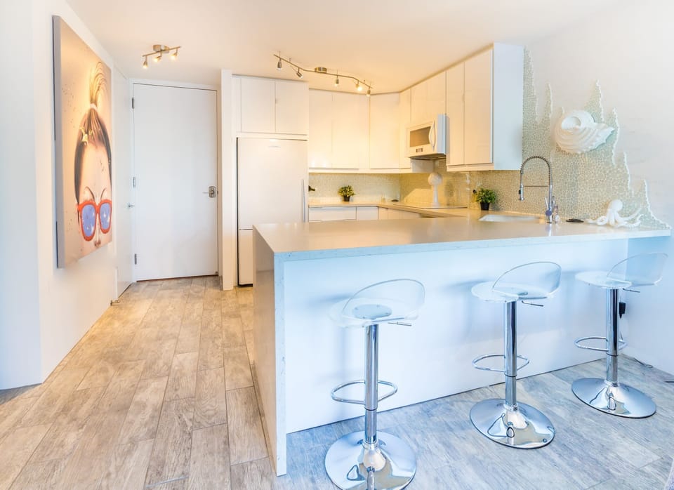 Gourmet Kitchen State of the Art Appliances,  Custom Waterfall Stone counter top