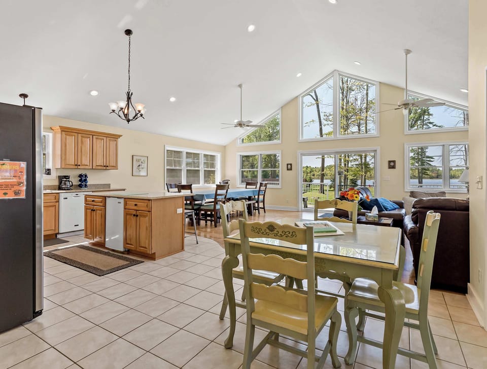 Wider overview of the Heron's Landing kitchen, breakfast table, and formal dining areas