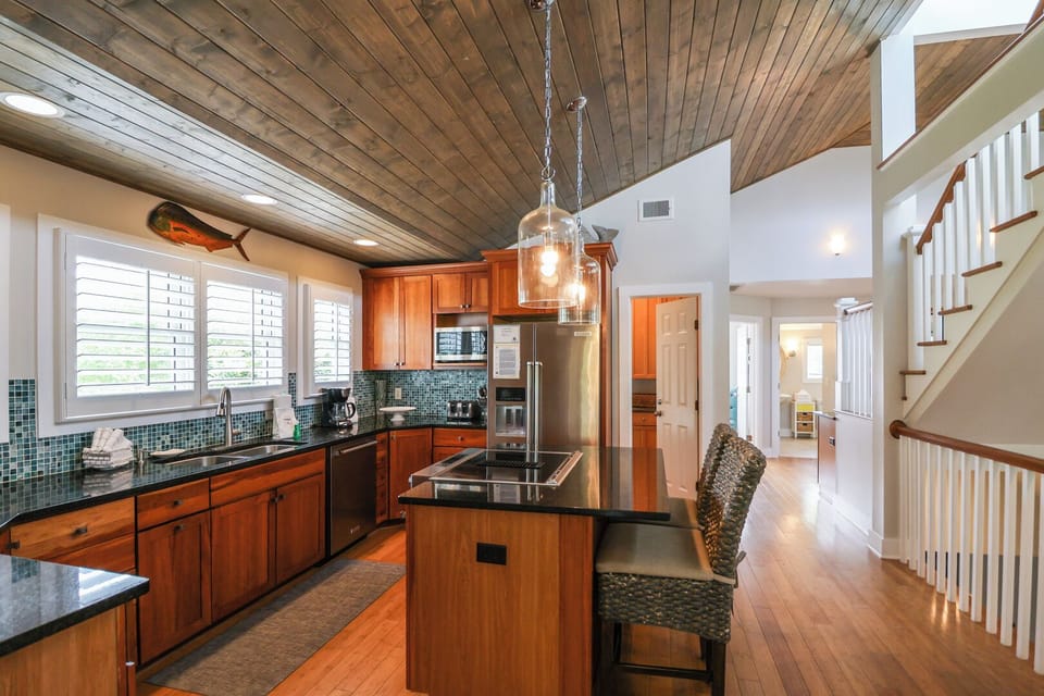 Large kitchen on the 3rd floor with extra seating at the bar