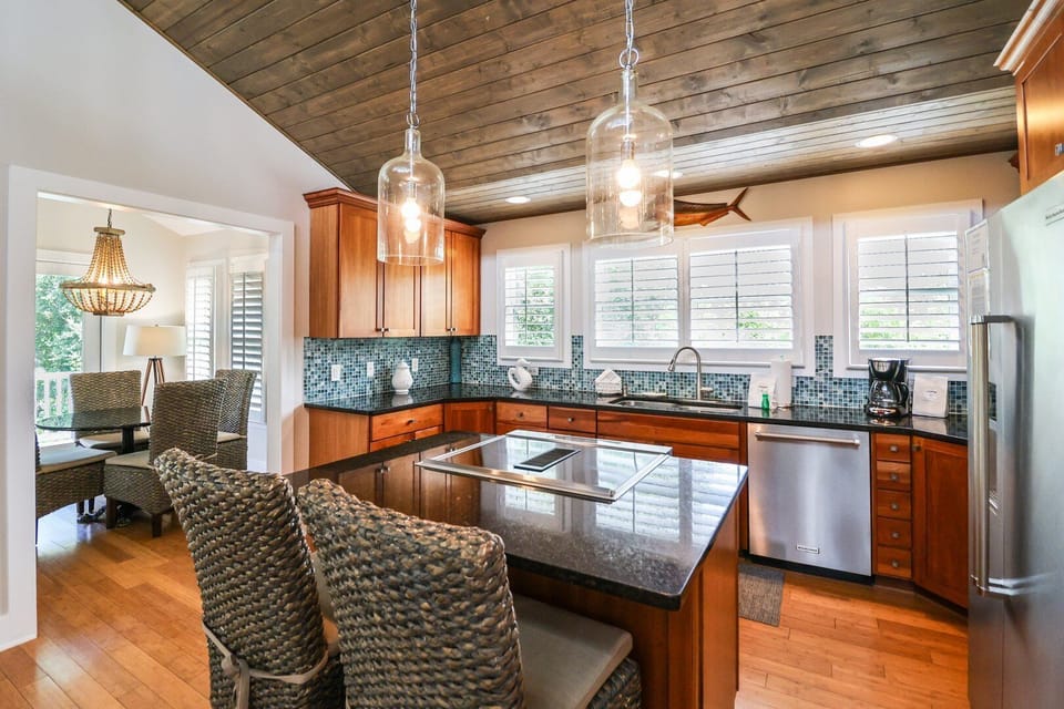 Large kitchen on the 3rd floor with extra seating at the bar