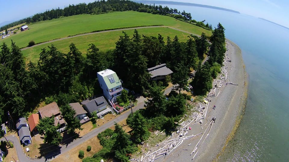 Aerial view of the cabin and miles of beach.
