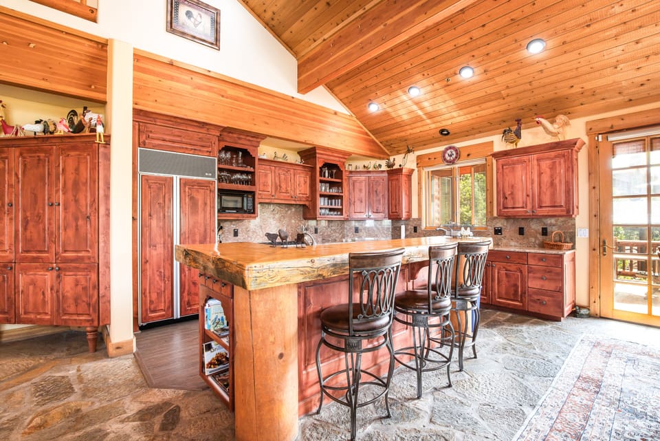 Pine bar island eat in area with wet bar/prep sink