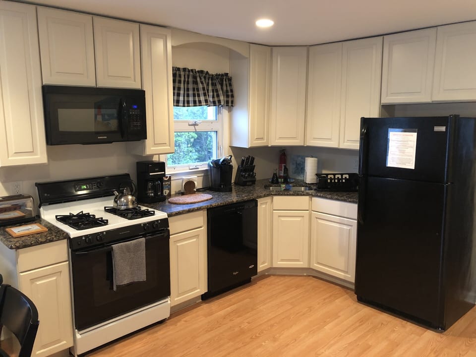 Kitchen with Microwave, Dishwasher, and Stove with Oven.