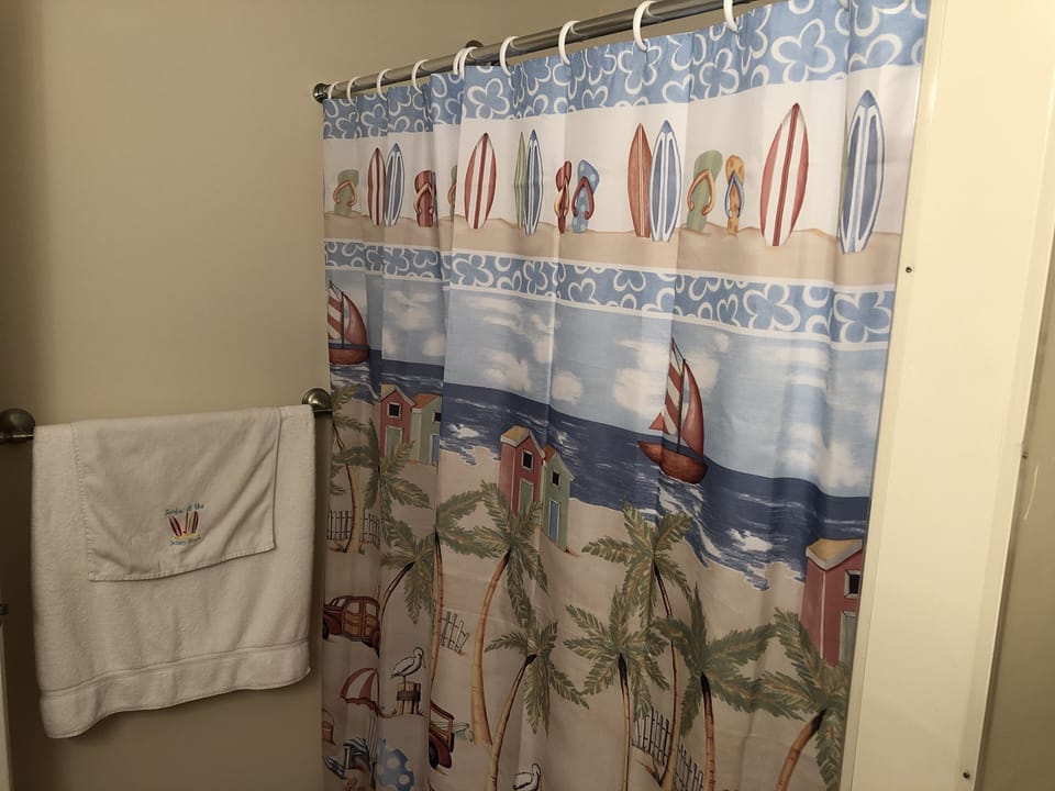 Bathroom includes shower with built in tub. 
