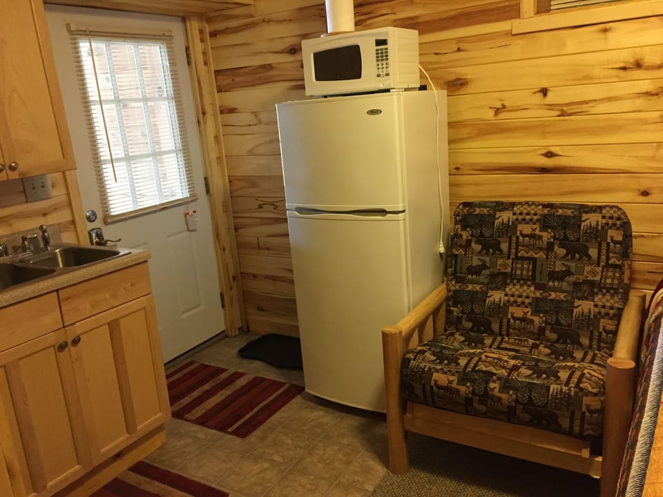 Full size refrigerator to store your food from your cooler and side chair.  