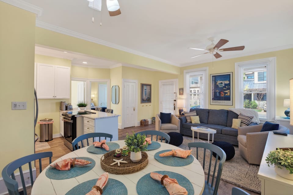 Light-filled coastal living where the kitchen, dining, and lounge flow together in one relaxed, breezy space.