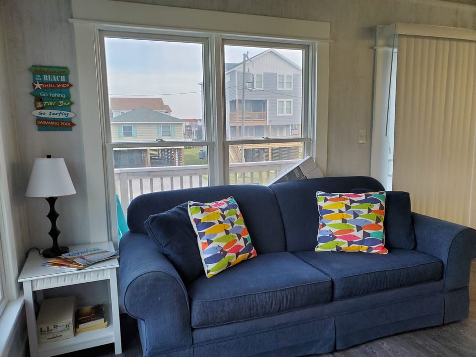 Upper level living with queen sleeper, tv, dvd, movies and game system.