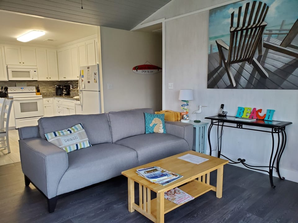 Upper level living room with queen sleeper,  tv, dvd player and game system