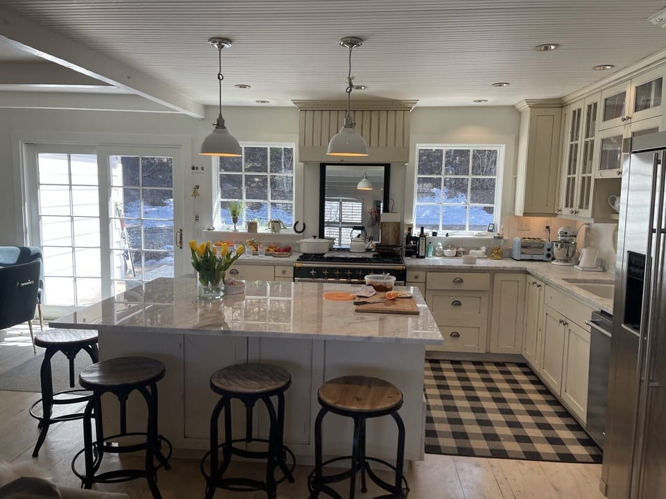 Open plan room into kitchen and outside back yard behind.