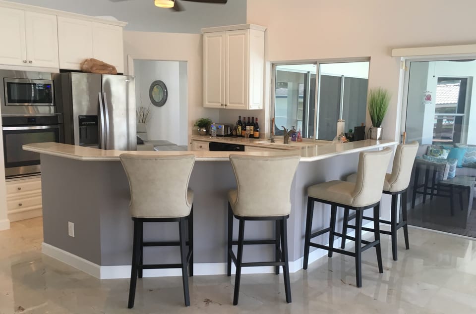 Wrap around Bar overlooking open Kitchen.