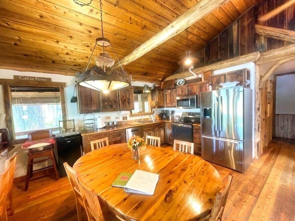 Full kitchen with all the essentials including tableware for 30.  Two refrigerator freezers, a mini-fridge, microwave, oven and stove, crockpot, panini maker, waffle maker, and griddle. 