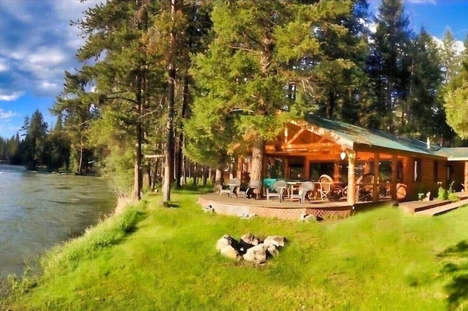 Main cabin is a 2 bedroom, 3 bathroom, 1 office and a washer/dryer.   It has a large deck that has 2 seating areas for 6 and 8, plus a long dining table that seats 14 comfortably.  It also has a handcrafted log pool table, foosball and 2 BBQ’s. 