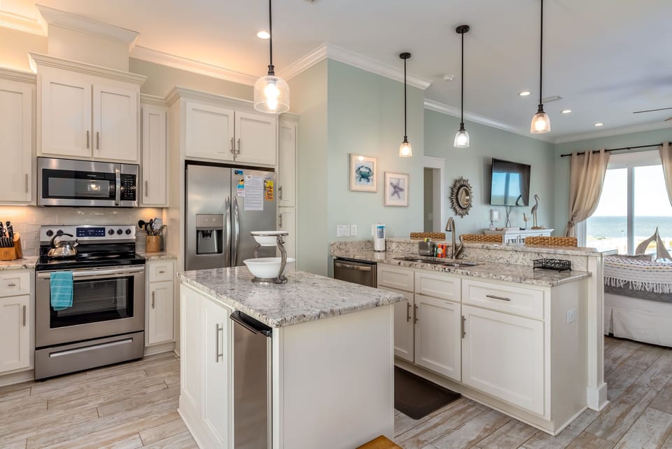 Your fully-equipped coastal kitchen invites you to create memorable meals with ocean views inspiring every moment.