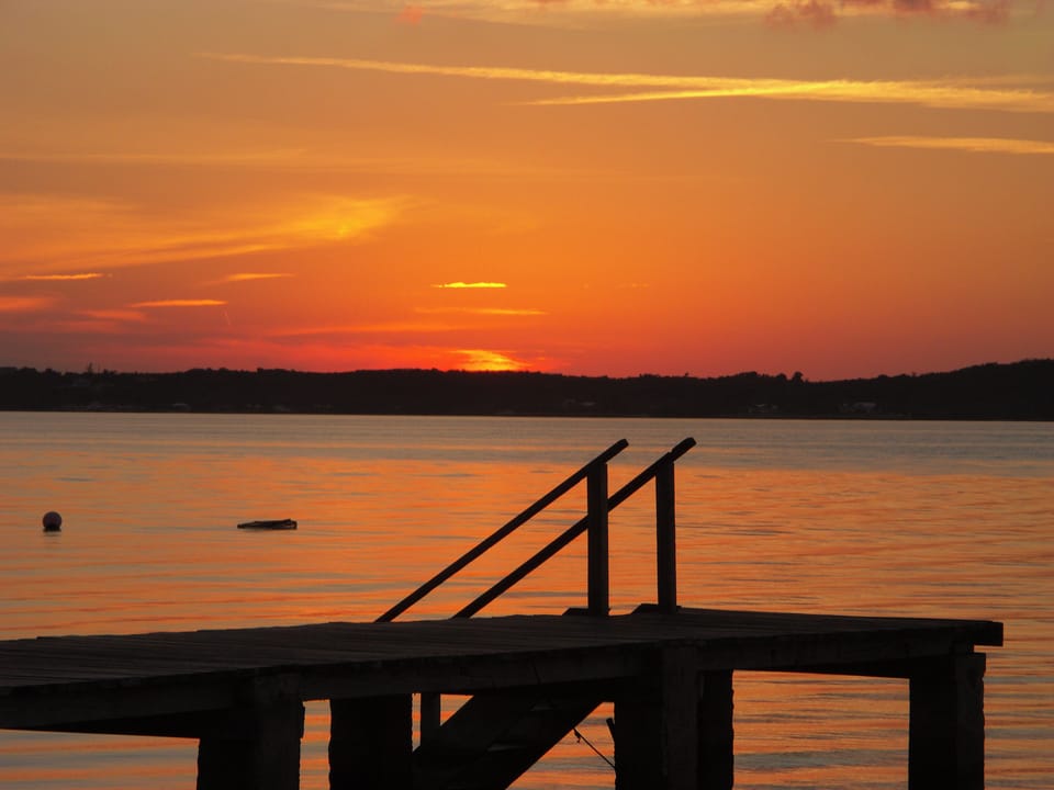 Blue Dolphin dock set in front of another best sunset