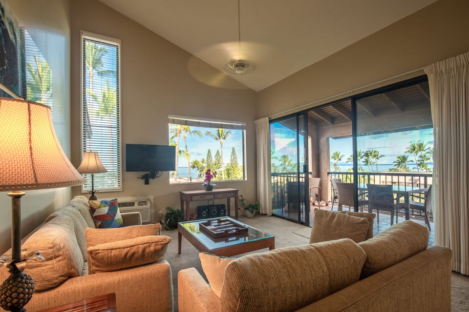 The cathedral-ceilinged living room features breathtaking ocean panoramas!