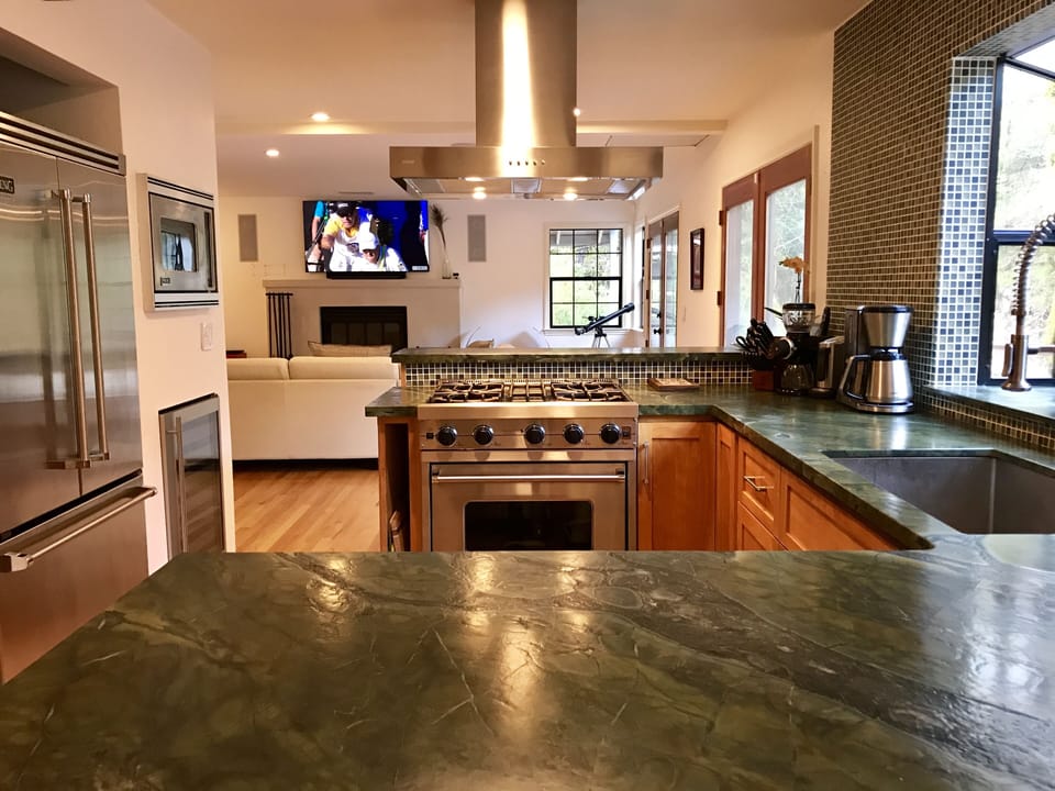 Custom kitchen w/Viking appliances and stone countertops