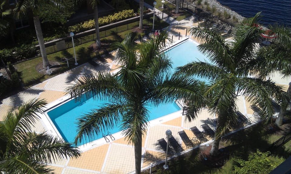 View to pool & rivers edge from penthouse patio/lani