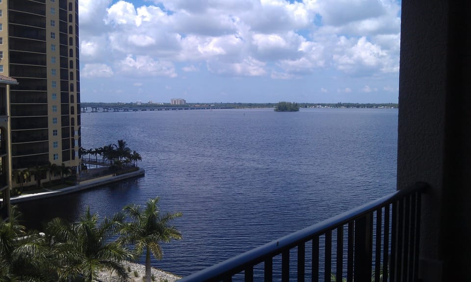 View of river from condo deck, patio/lani. Comfortable table & chairs enjoy view