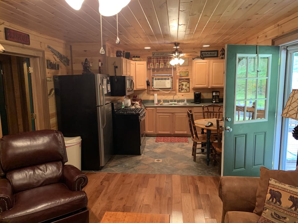 Our cozy Kitchen features a Gas Range, Oven, Microwave Oven, and Dishwasher