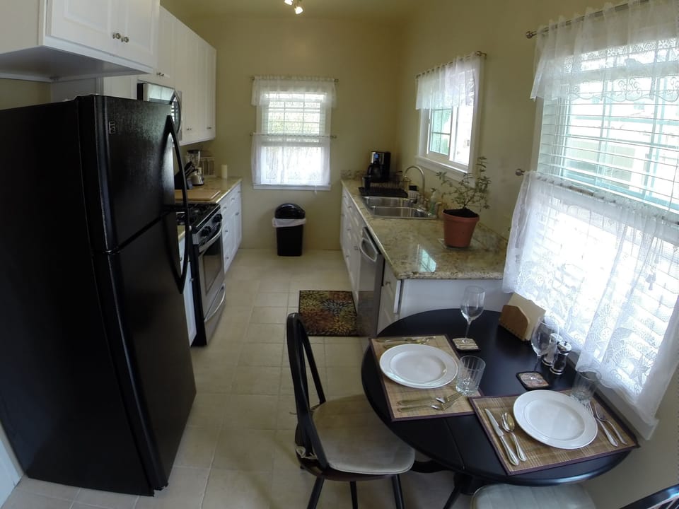 kitchen (continued) furnished with dishes, glassware & pans plus decorative ware