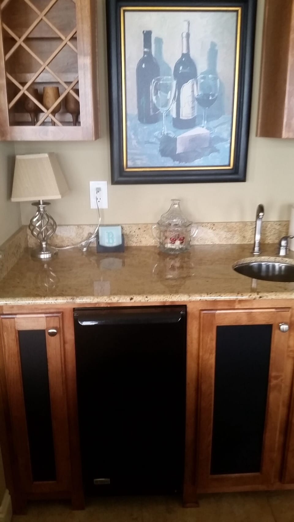 Wet bar which houses a built in ice maker.
