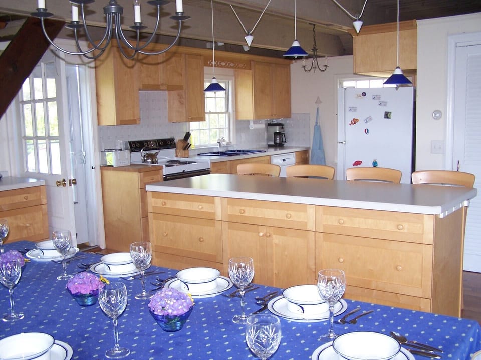 Fully stocked kitchen with custom made cabinets.