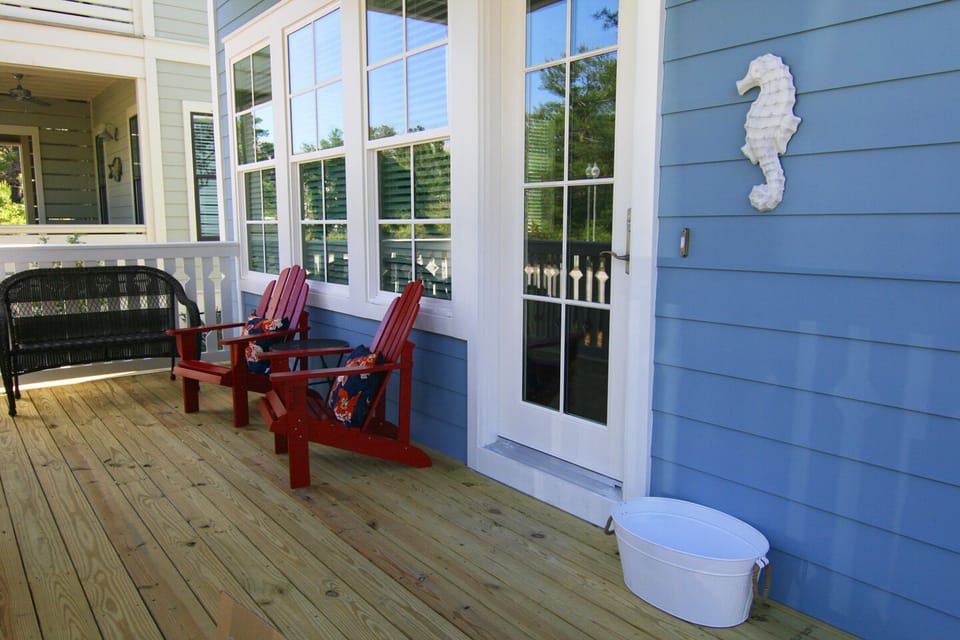 the front porch and upstairs deck are the perfect places to relax