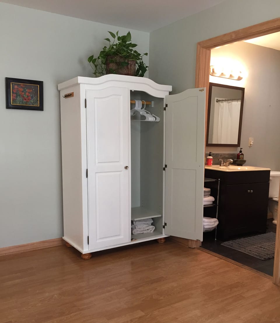 An armoire is available to hang clothes.