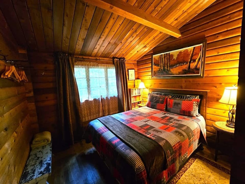 Step into the back queen bedroom.