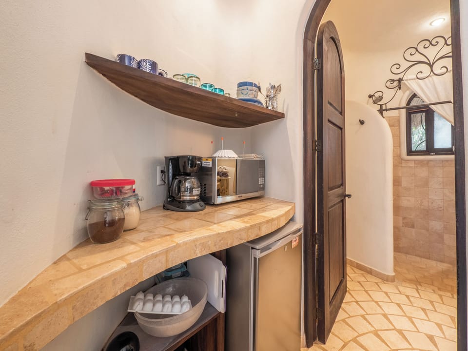 Kitchenette leading to bathroom