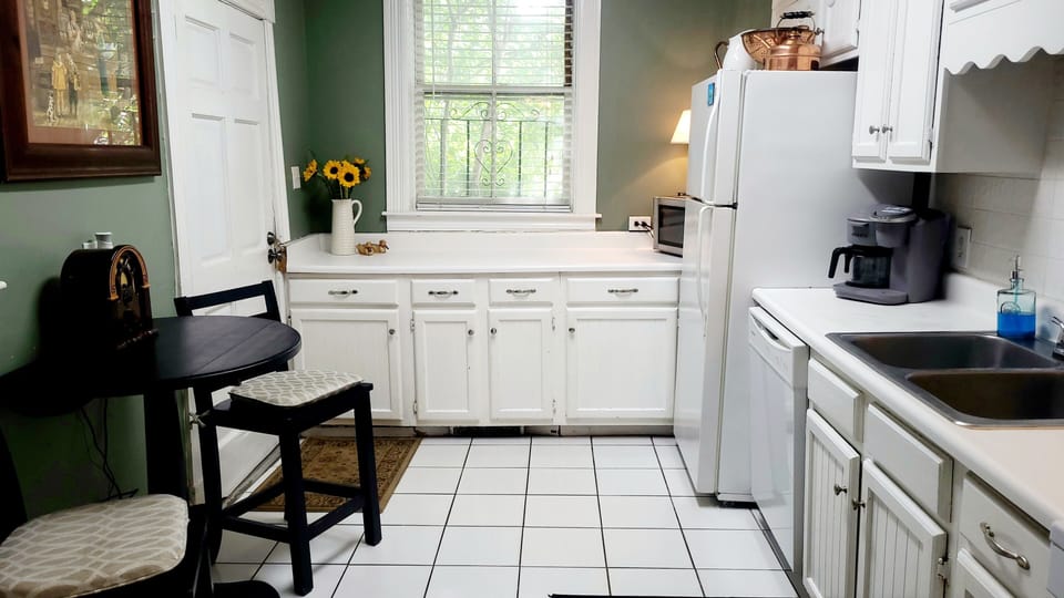 Kitchen Located at Rear of Home with  Gas Stove and Breakfast Seating for 2