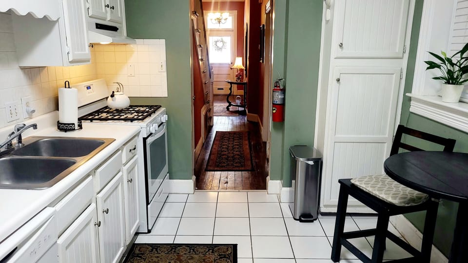 Galley kitchen with all the essentials in this historic Victorian-era townhome.