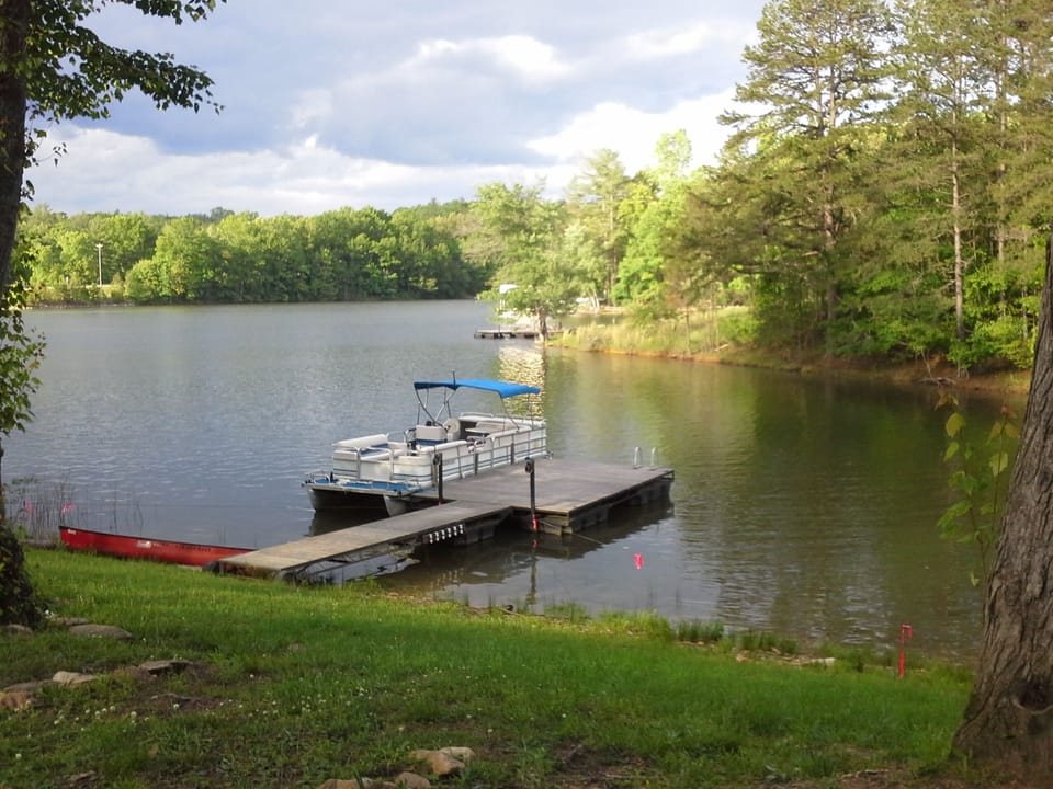 Our dock, the canoe and the pontoon boat available to rent.