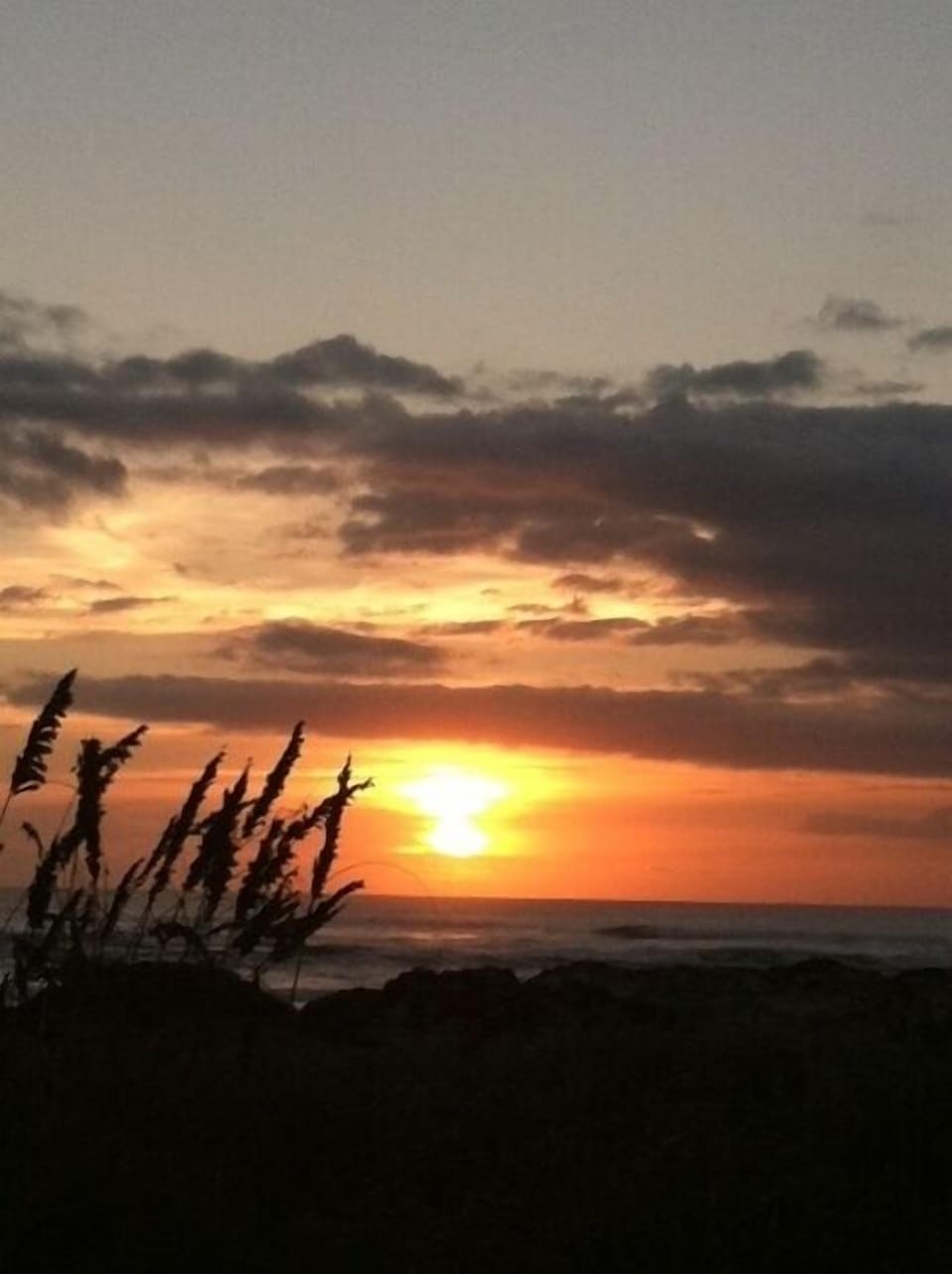 Sunrise while sitting on the dunes right outside the door!