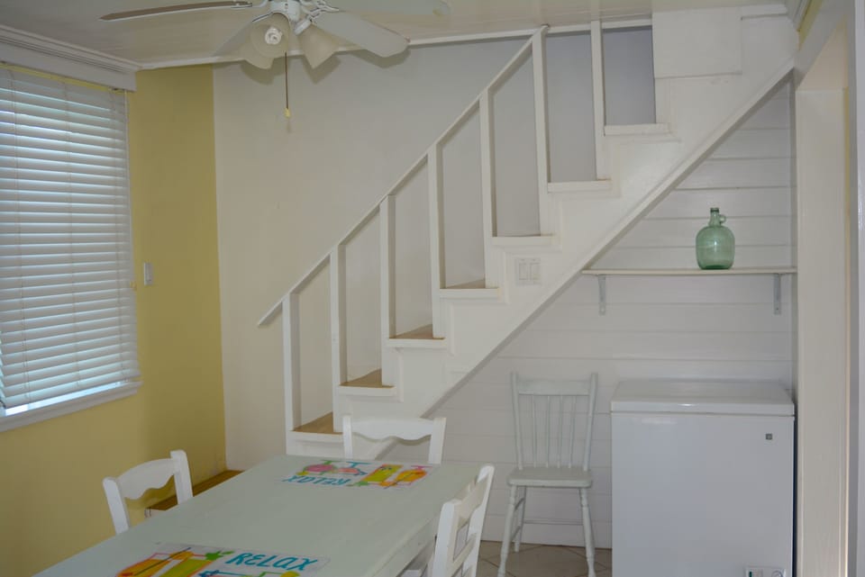 Dining area, steps upstairs and chest freezer for ice, bait and your catch