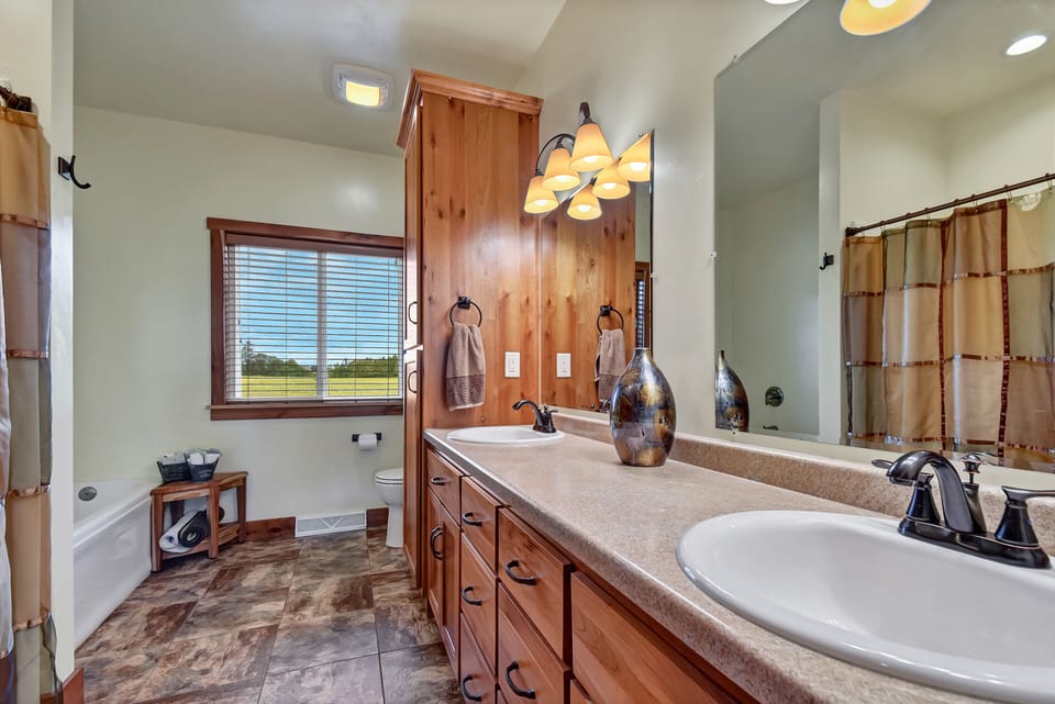 First floor bathroom with jetted tub and separate shower. 