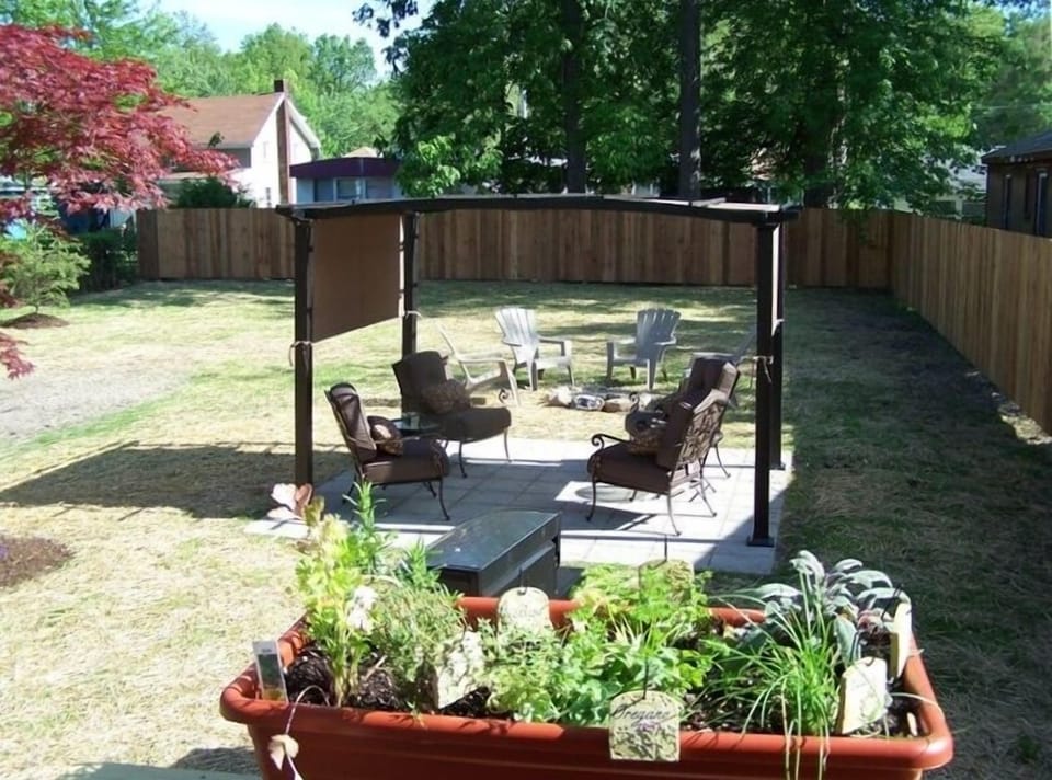 Back door railing overlooking pergola