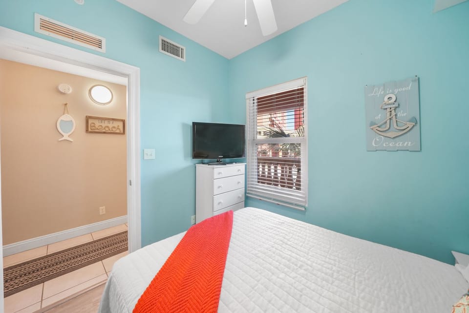 Drift off peacefully in your coastal bedroom, where ocean-inspired turquoise walls and nautical touches create the perfect seaside retreat.