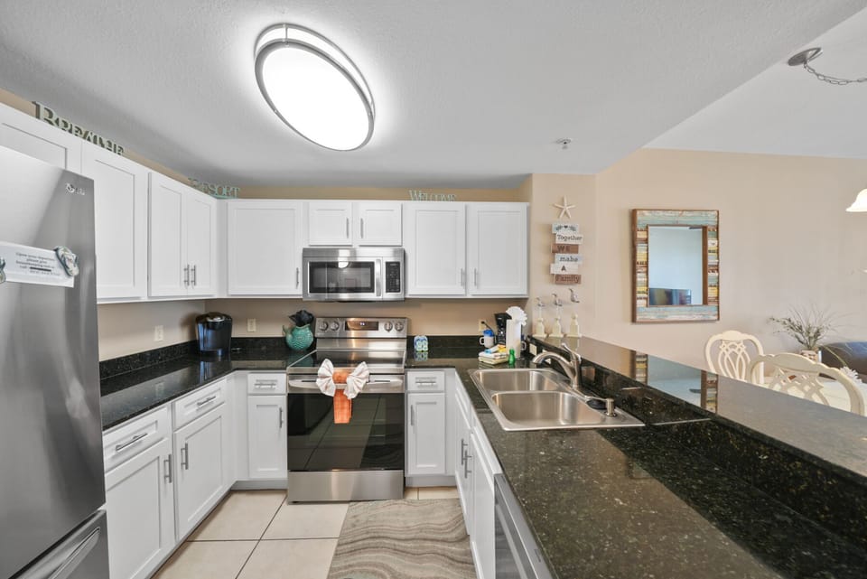 Your fully equipped kitchen awaits with granite counters, stainless appliances, and everything you need to create memorable meals during your stay.